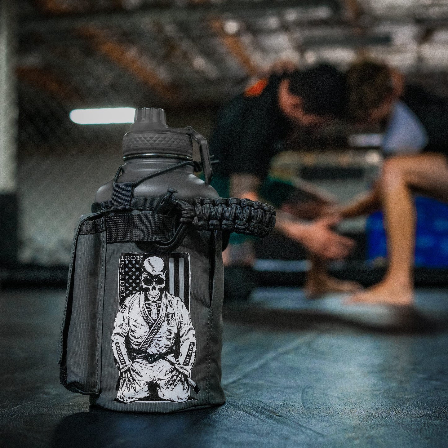 Iron Infidel Battle Bottle - Half Gallon Water Bottle Insulated, 64 oz Stainless Steel Water Jug with Handle - Gym Water Bottle for Men with Rugged Sleeve for Storage (Earned, Not Given 2 Liter)